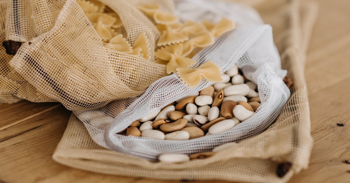 Are refried beans supposed to be slimy and nasty smelling? - White and Brown Stones on White Textile