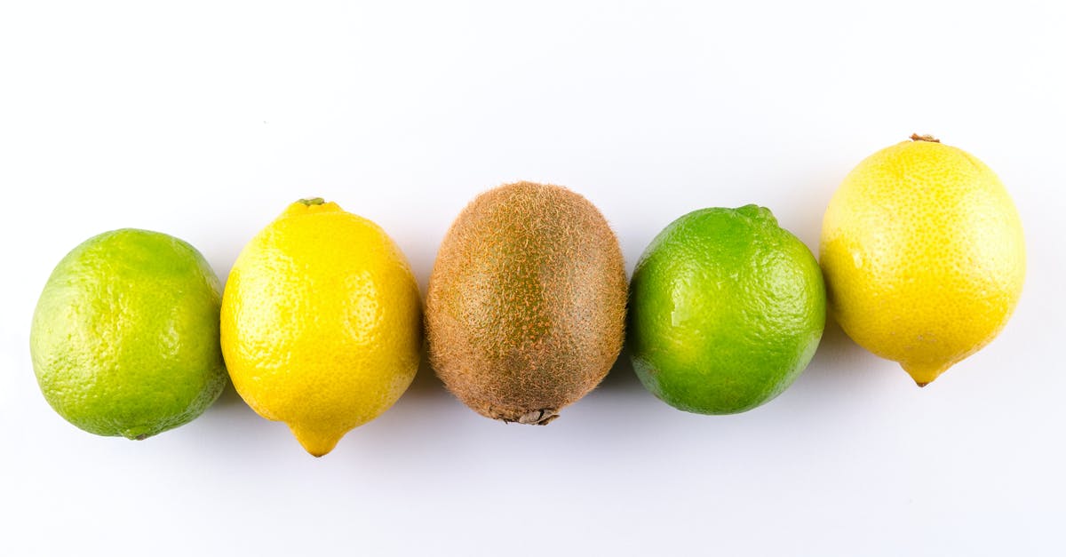 Are ripe meyer lemons supposed to be soft? - Flat Lay Photo of Two Lemon, Two Limes, and One Kiwi