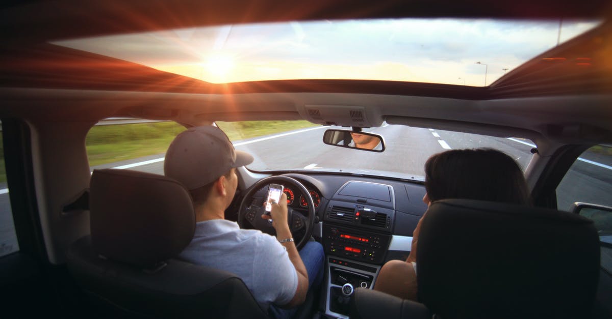 Are rotting potatoes dangerous when coming in contact with skin? - Man Using Smartphone While Driving