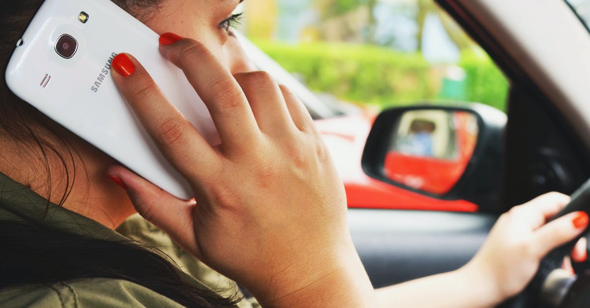 Are rotting potatoes dangerous when coming in contact with skin? - Woman Driving Car While Calling on Smartphone