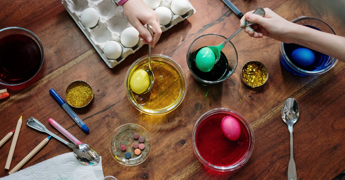 Are scratched glass bowls safe to use? - People  Holding  Silver Spoons With Colored Eggs