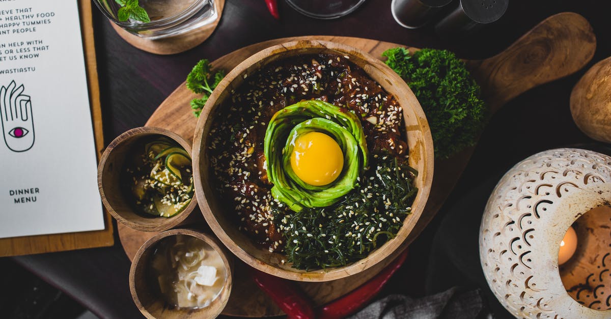 Are sesame greens served raw, or cooked? - Healthy east dish served on wooden cutting board in cafe