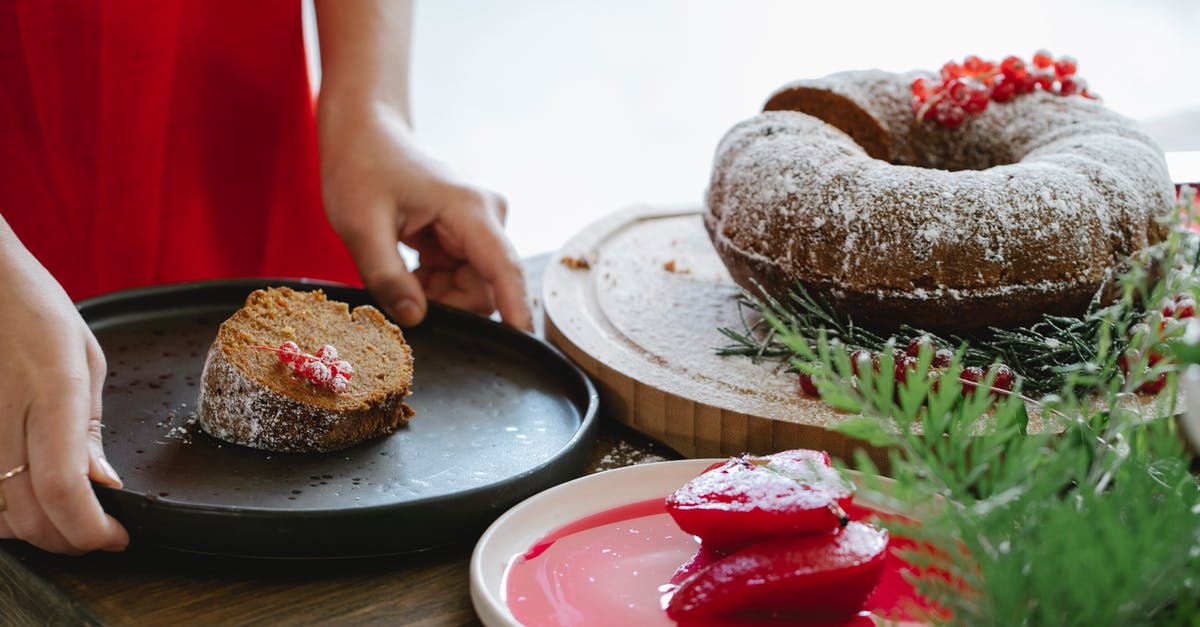 are syrup more flavorful than powder or similar? - Crop unrecognizable female chef with delicious piece of cake with red currants on plate in house