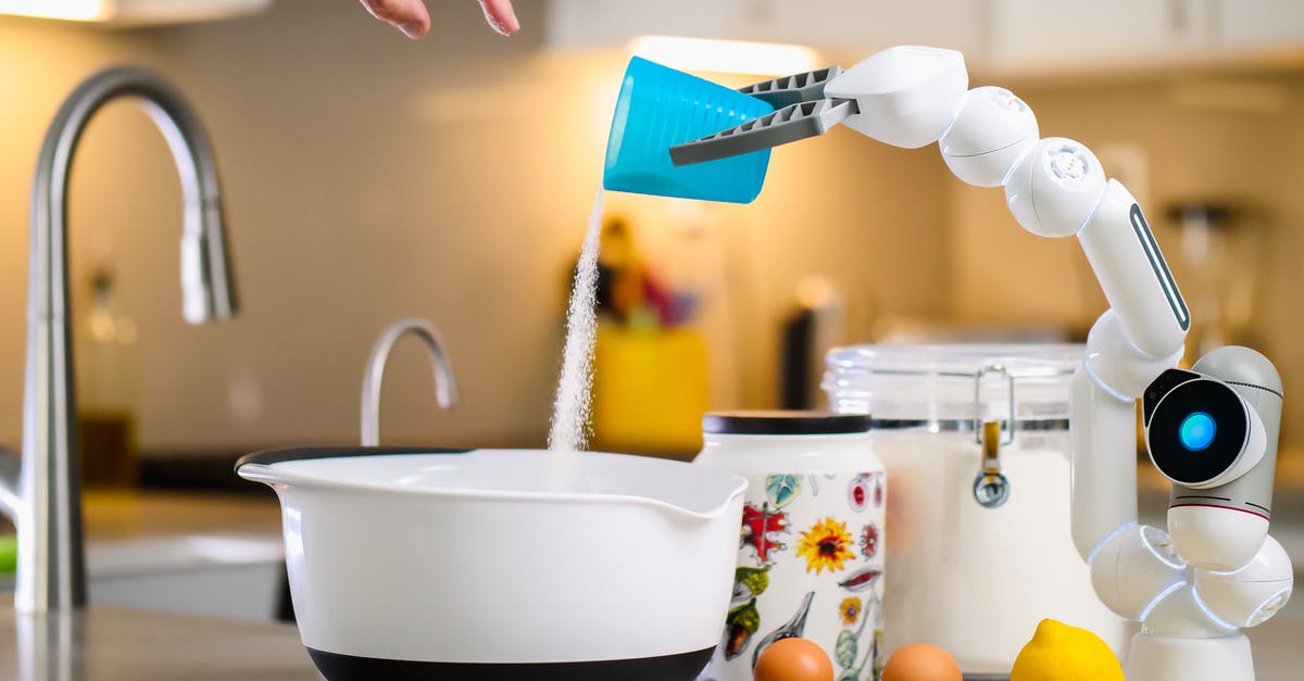 Are the eggs in semi-freddo cooked? - Robot Hand Pouring Flour into White Bowl