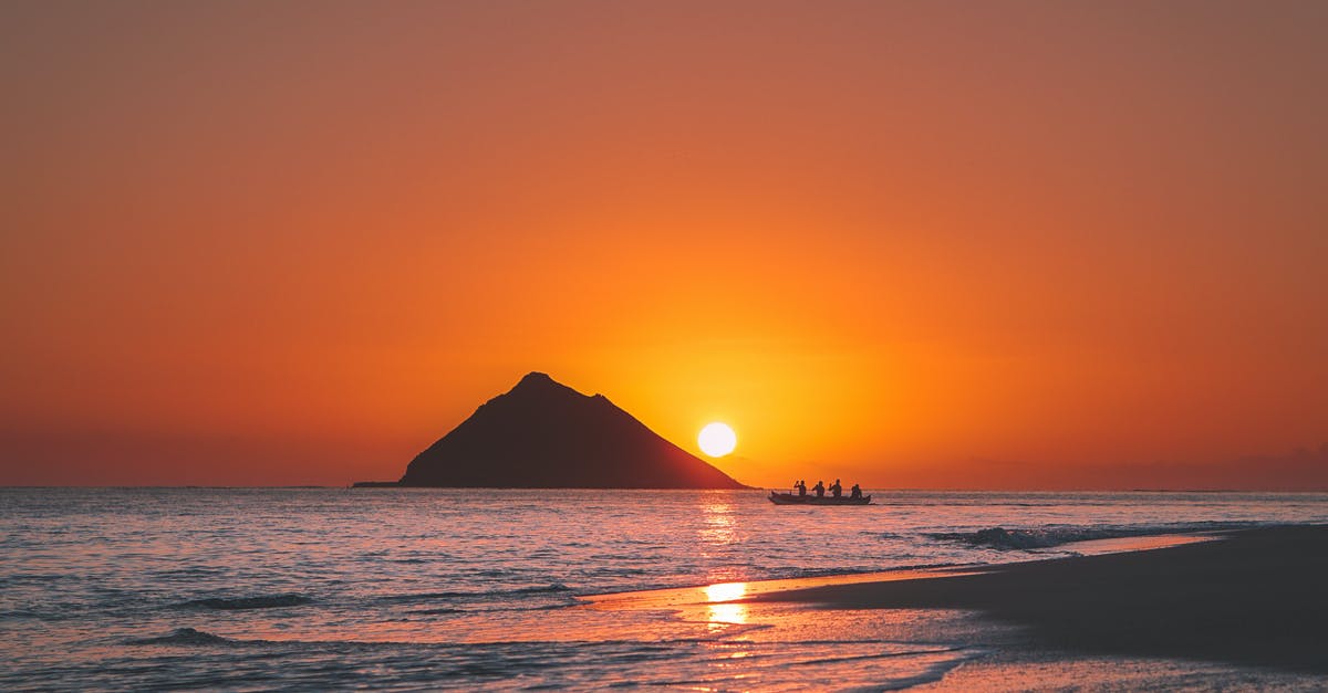 are the larger snails in Hawaii edible? - Silhouettes of Mountain and People Riding a Boat