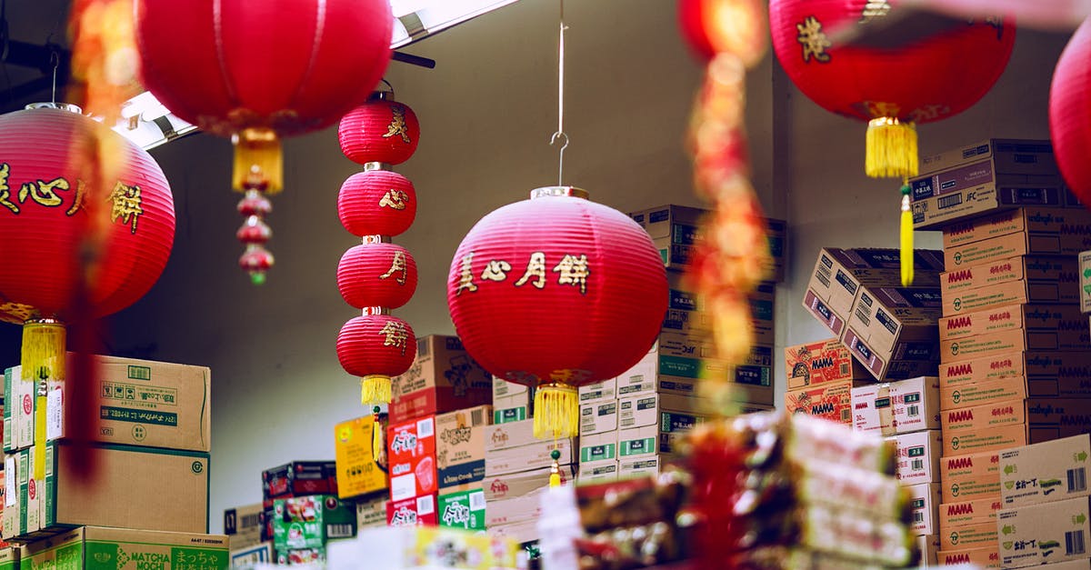 Are the leftovers from making stock good for anything? - Colorful Chinese lanterns hanging amidst carton boxes with food in storage on market