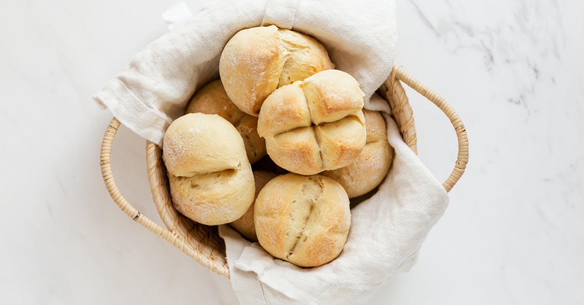 Are the white things on a bread normal? - Fresh white bread buns in wicker basket