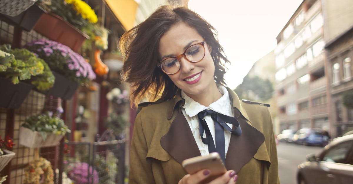 Are there any benefits in refrigerating stock before using it? - Woman Beside Flower Shop Using Smartphone