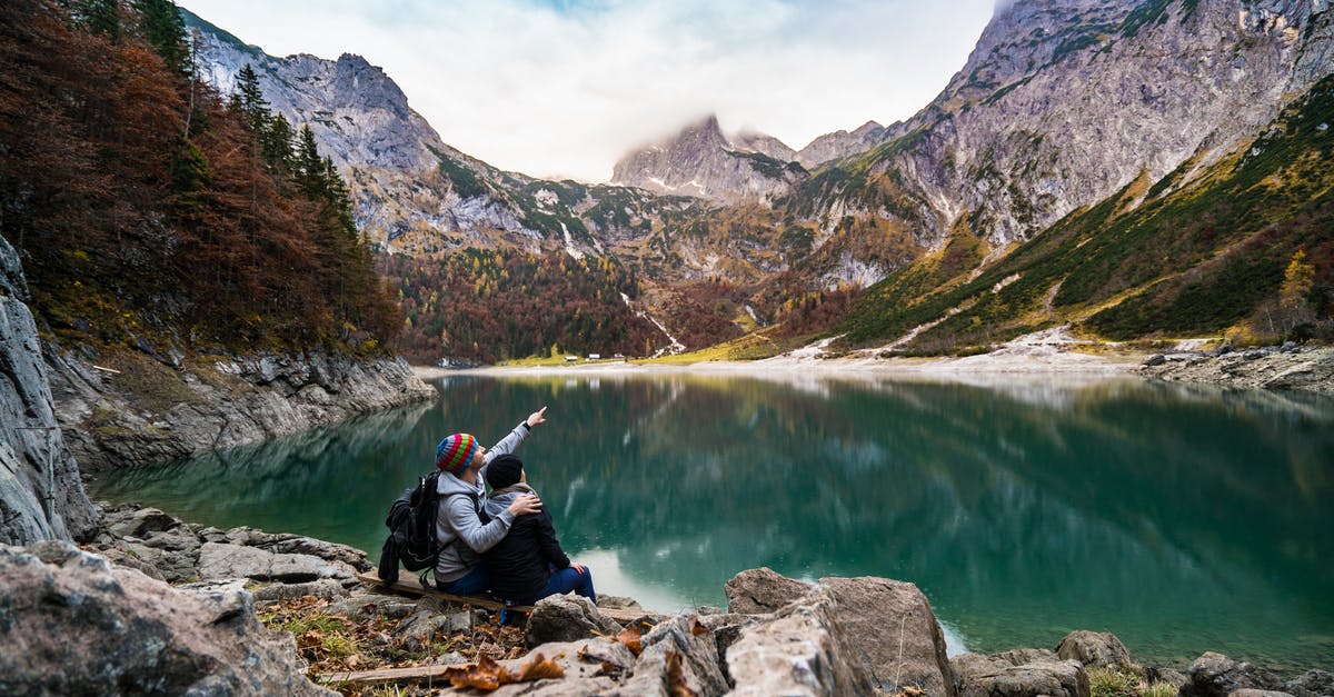 Are there any naturally sweet legumes? - Couple Sitting on Rock Beside Lake