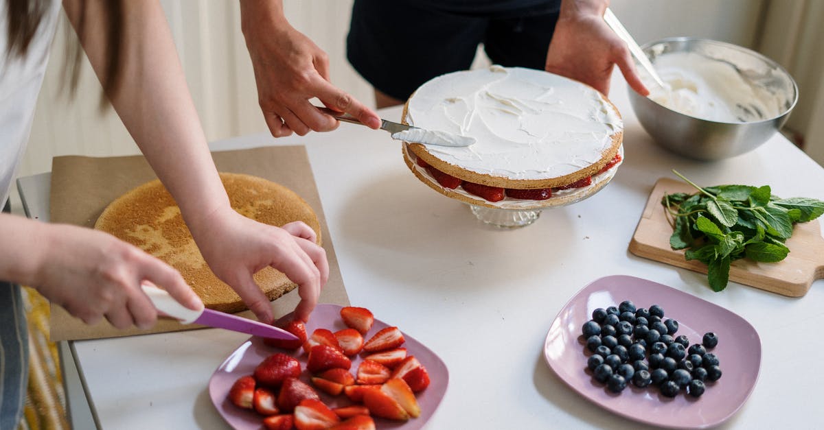 Are there any tricks to making a light-textured "whipped cream cake"? - Person Holding Stainless Steel Spoon With Red Round Fruits