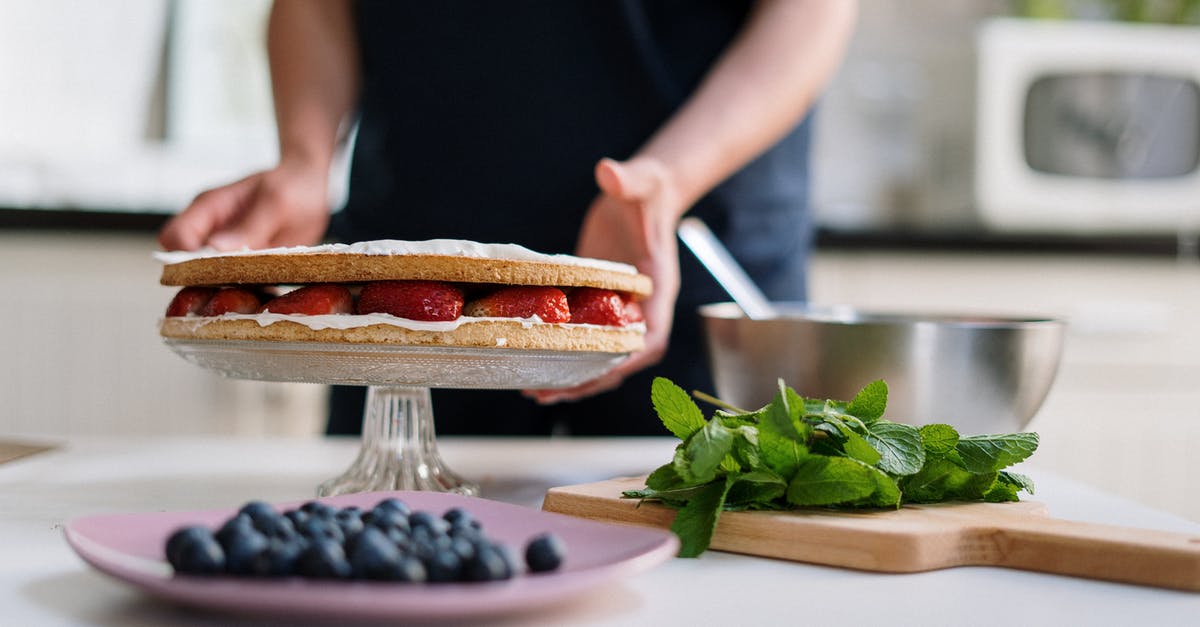 Are there any tricks to making a light-textured "whipped cream cake"? - Person Holding a Knife Slicing a Food on a White Plate