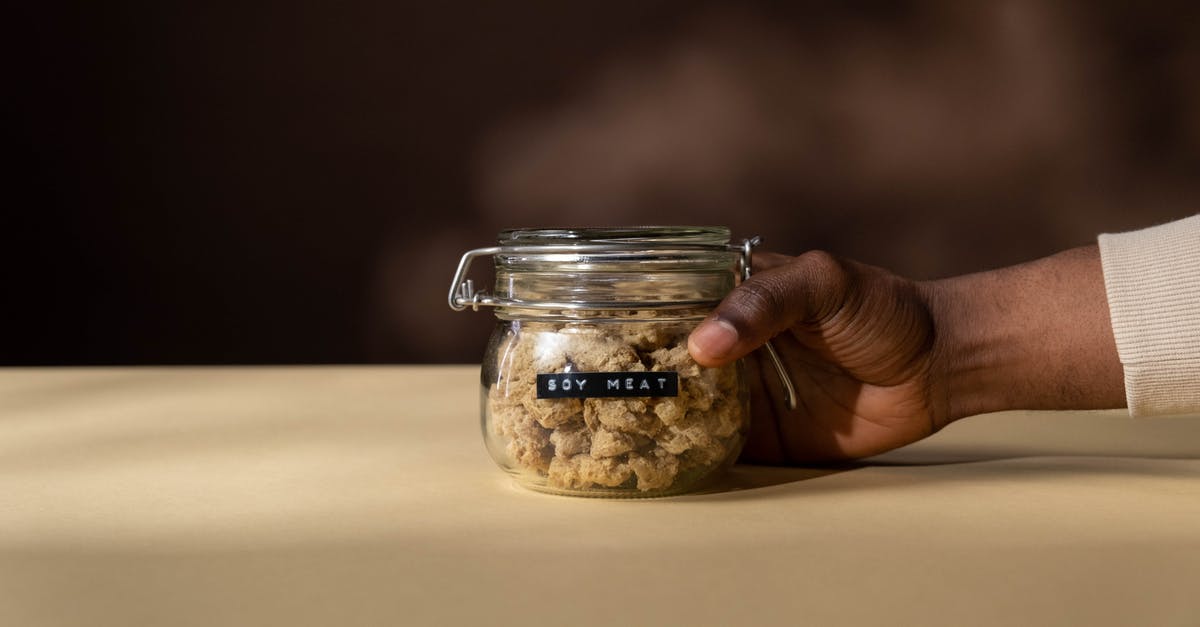 Are there any vegetarian applications for transglutaminase ("meat glue")? - Close-Up Shot of a Person Holding a Jar of Soy Meat