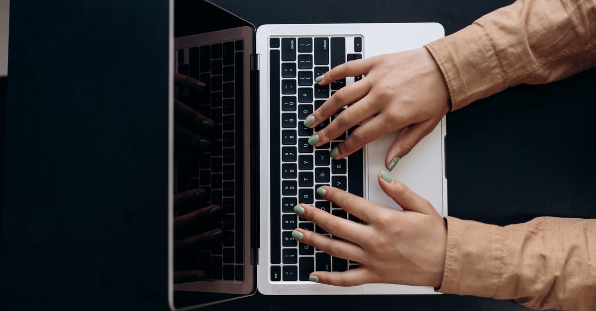 Are there benefits to using a lemon squeezer? - Person Using Macbook Pro on White Table