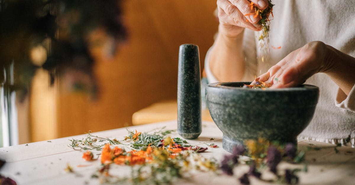 Are there substantial benefits to grinding your own flour? - Person Holding White Ceramic Bowl