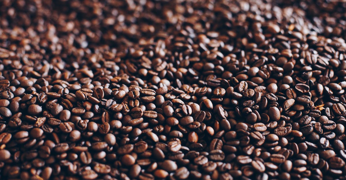 Are these coffee beans unroasted? - Close-Up Photography of Roasted Coffee Beans