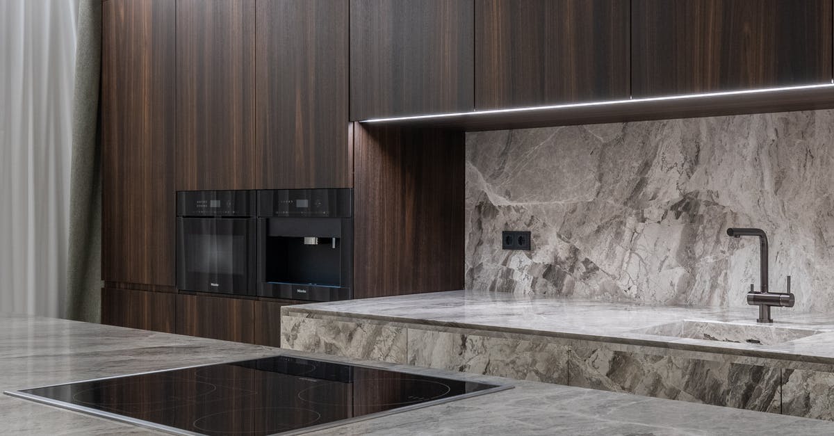 Are they're any ovens that have Programmable Stove top element features like an OVEN start stop feature? - Stylish kitchen interior design with appliances