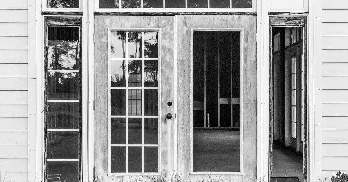 Are those skillets damaged? [duplicate] - Grayscale Photo of Closed Door