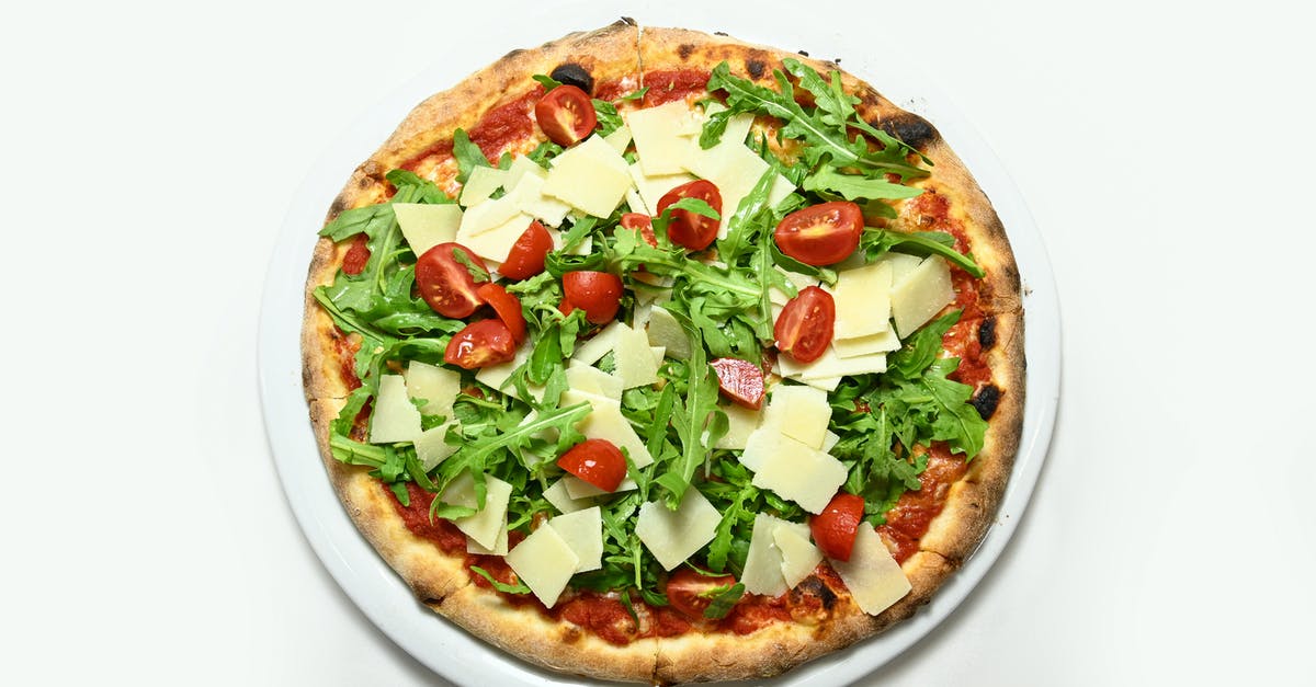 Arugula is very salty, and doesn't look like arugula - Pizza rocket Rucola you parmesan cherry tomatoes isolades