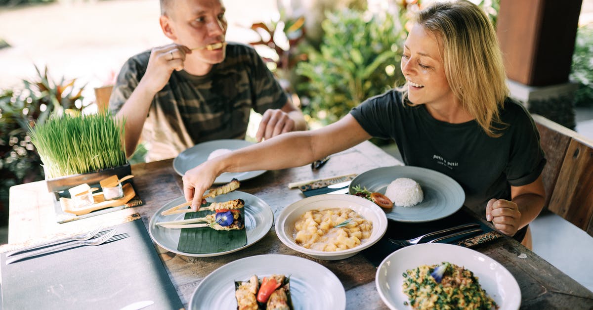 Astringent Dishes - Man and Woman Eating Dinner on a Terrace