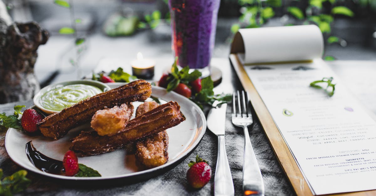 Authentic Asian Sweet & Sour Sauce - Recipe [closed] - Crispy sweet churros served with sauce and strawberries and placed on table near menu and fresh blueberry smoothie