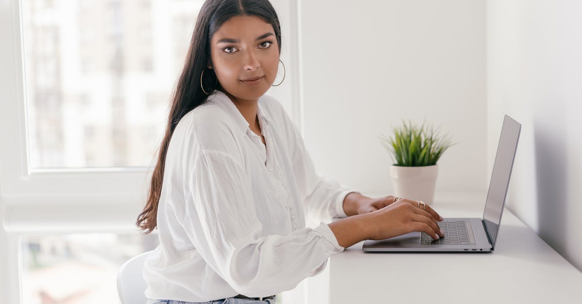 Avoiding clumps in cacio e pepe? - Woman in White Dress Shirt and Blue Denim Jeans Sitting on White Chair