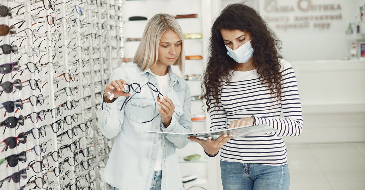 Bad tasting mussels and avoiding buying them - Woman Choosing Glasses at Optician Salon