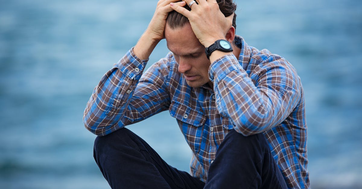 Bagel Failure - what happened? - Man in Blue and Brown Plaid Dress Shirt Touching His Hair