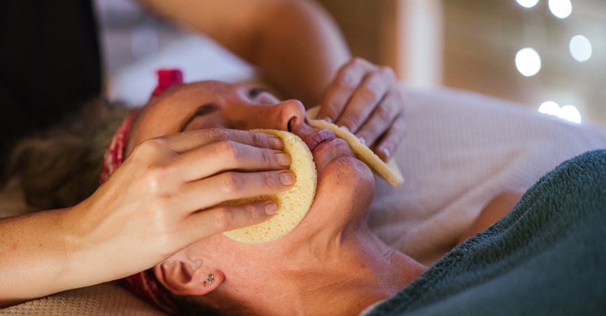 Bagel Sponge: Room Temp or Proofing Temp? - Adult lady in towel getting face massage with sponge from massager in spa