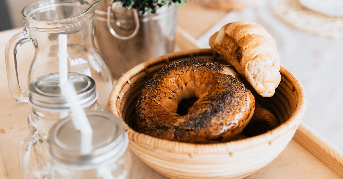 Bagels: Alternative to cornmeal on the baking sheet? - Baked Bread in Beige Ceramic Bowl