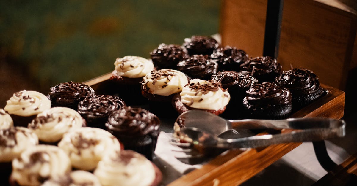 Baked 2 cakes simultaneously. One sank in the middle on cooling - Chocolate Cupcakes on Tray