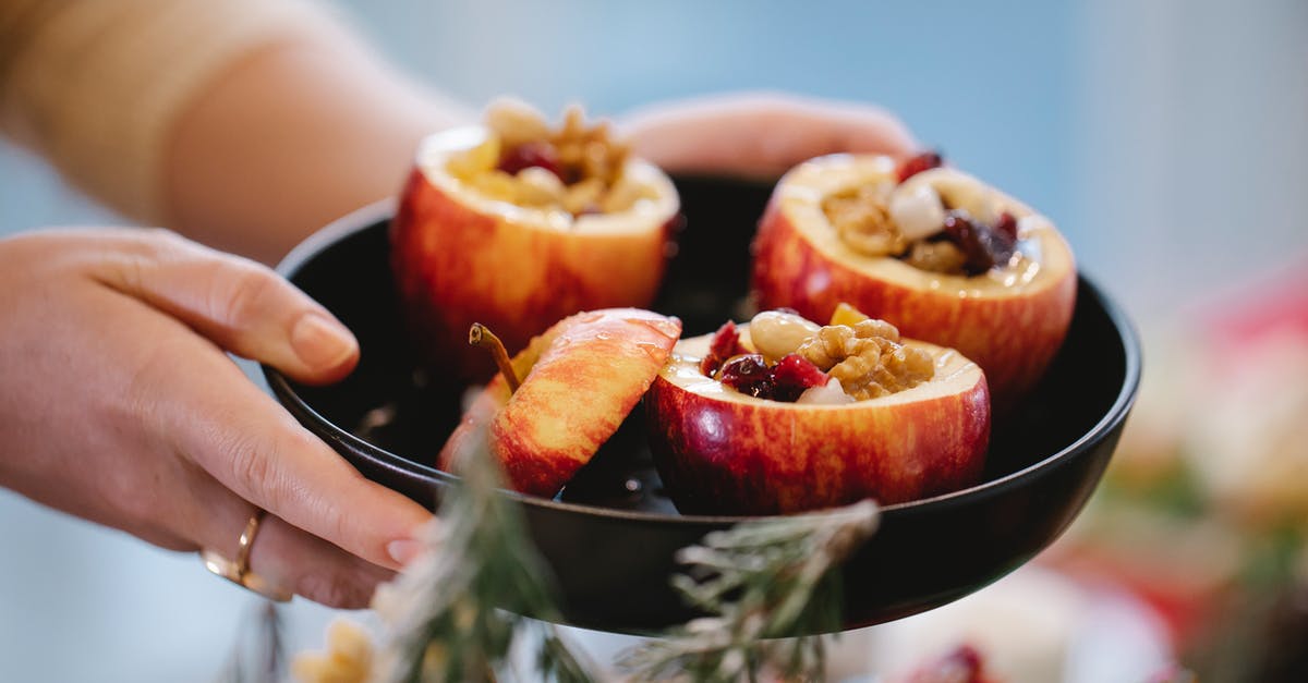 Baked Stuffing and cooking the turkey - Crop chef with tasty stuffed baked apples during Christmas holiday