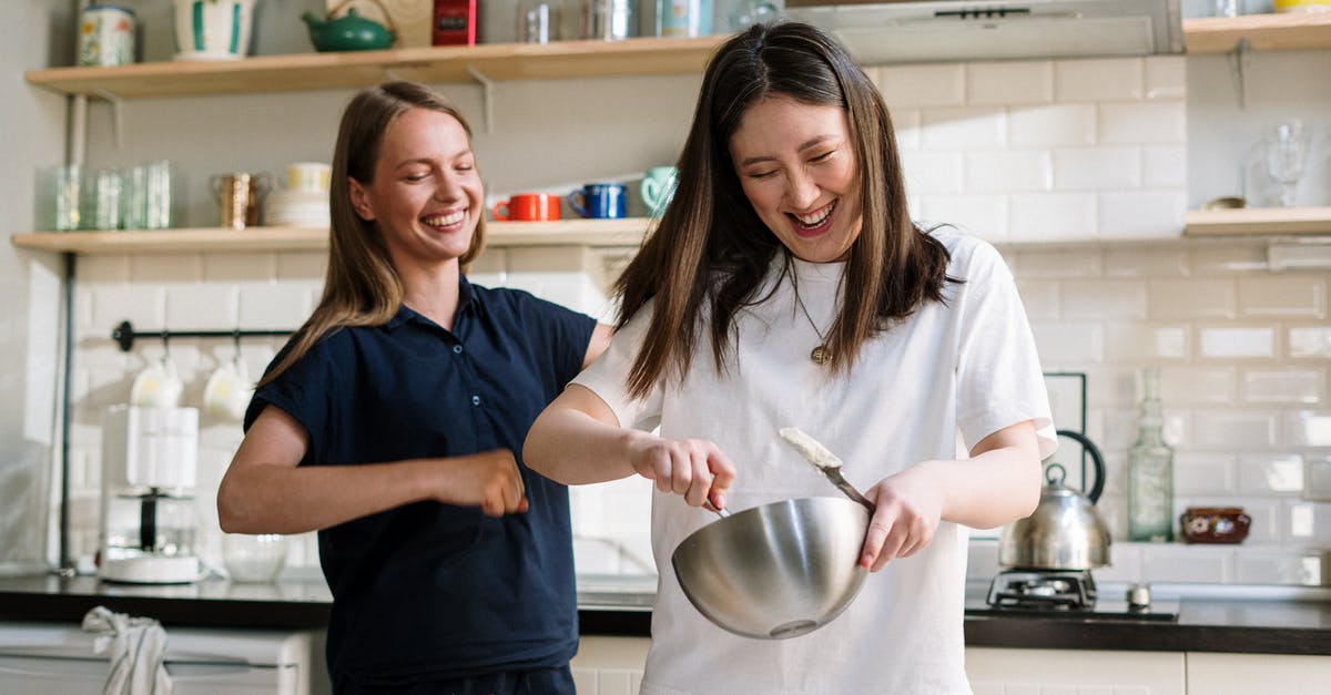 Baking 'Master' Recipes - Woman in Blue Crew Neck T-shirt Holding Stainless Steel Bowl