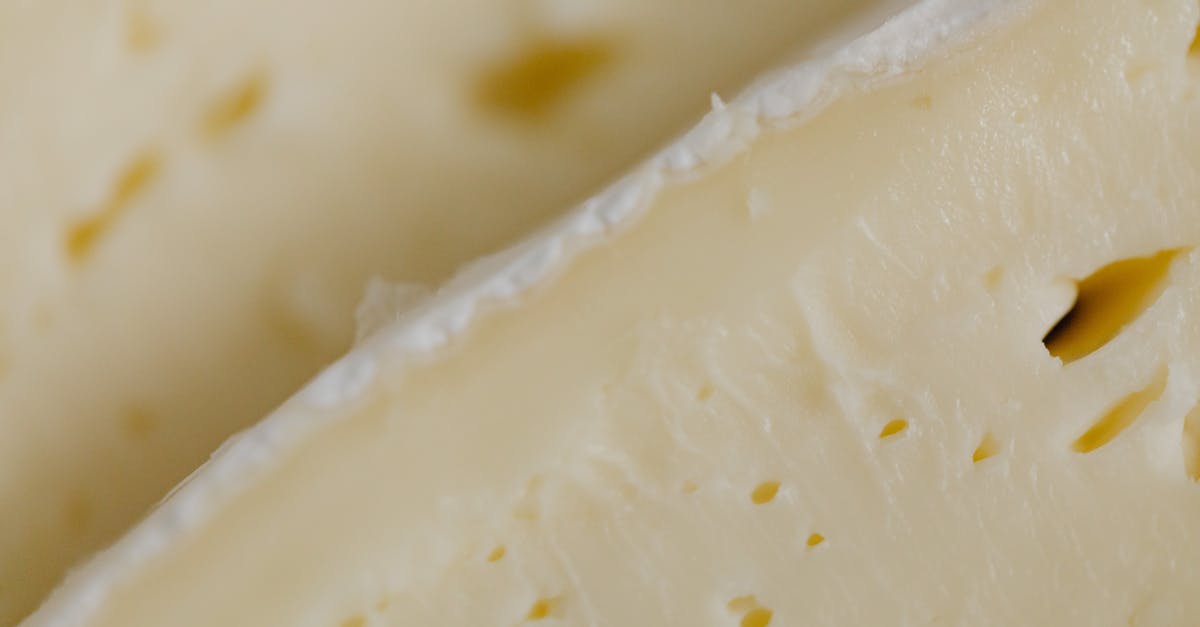 Baking a Brie with the outer rind broken - White Cheese in Close-up Photography