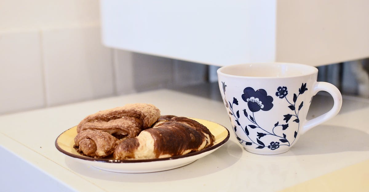 Baking beetroot in coffee crust - Mug of coffee and croissants on table