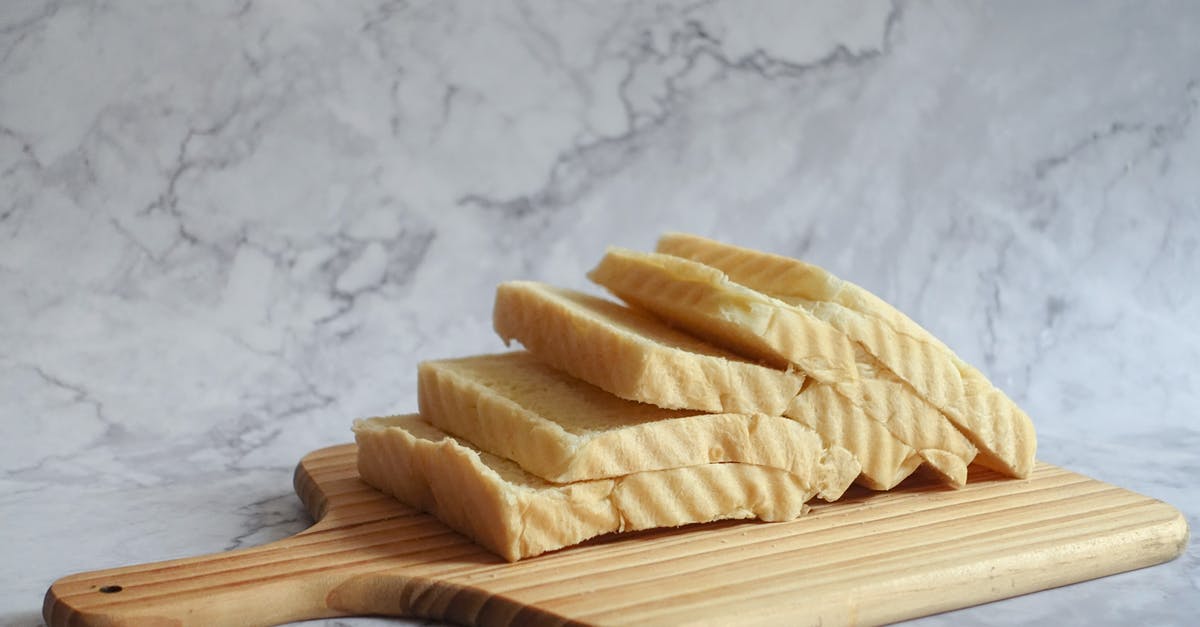 Baking bread with spelt flour, without using a bread pan - Slice Bread on Brown Chopping Board