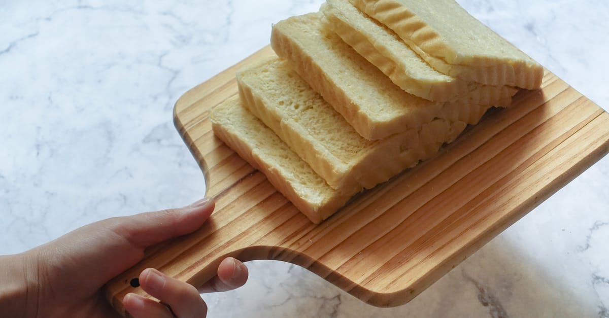 Baking bread with spelt flour, without using a bread pan - Brown Wooden Chopping Board