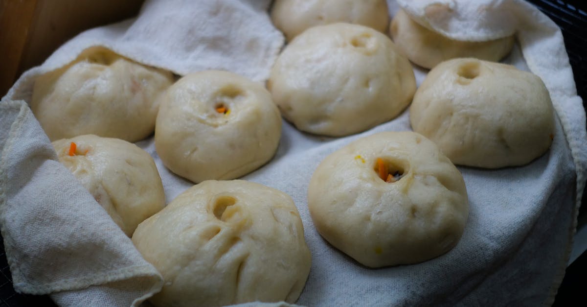 Baking German white bread rolls - Dumplings on White Textile