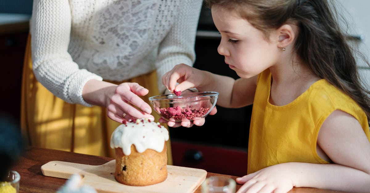 Baking Italian love cake - Girl in Yellow Shirt Holding Brown Cake