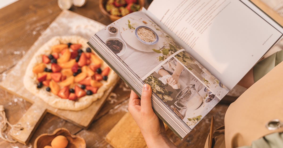 Baking (pizza) stone and effects on puff pastry - Person Holding Cookbook