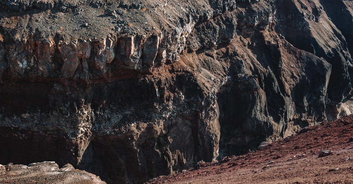 Baking side of pizza stone - Amazing view of one side of brown and black rocky ravine on sunny day