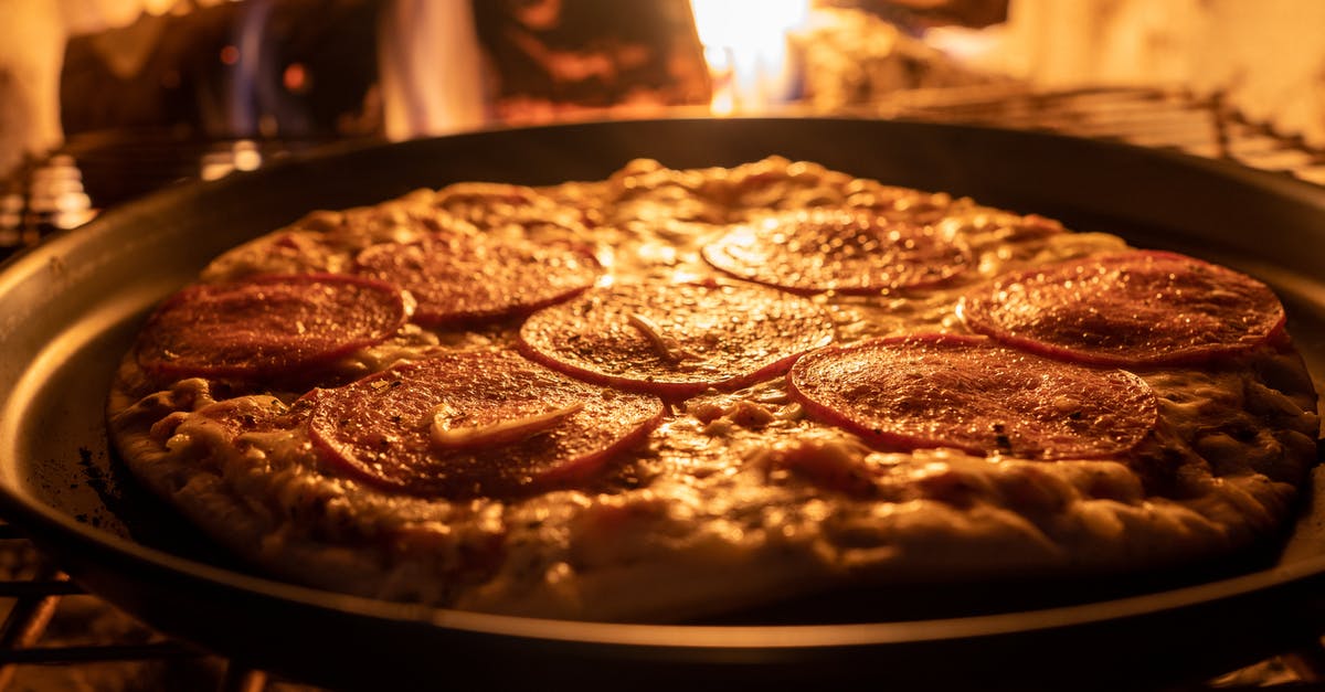 Baking with oven without bottom heating element - Close-Up Shot of Pizza Getting Cooked Inside the Oven