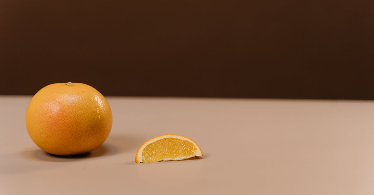 Balance out lemon juice in a smoothie, stinging my throat - Two Orange Fruits on White Table