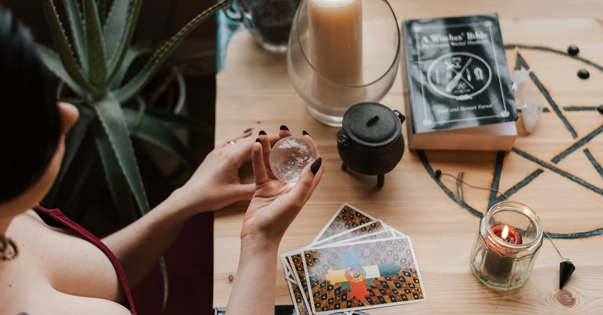 Ball Canning Jars: Use them over and over? - From above of crop unrecognizable female soothsayer with magic ball near tarot cards and candles during divination process in house