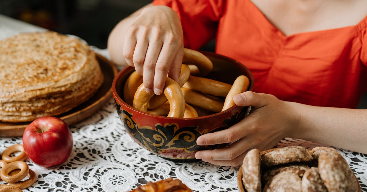 BBQ-style baked beans without mustard? - Person in Red Long Sleeve Shirt Holding Brown Wooden Round Bowl