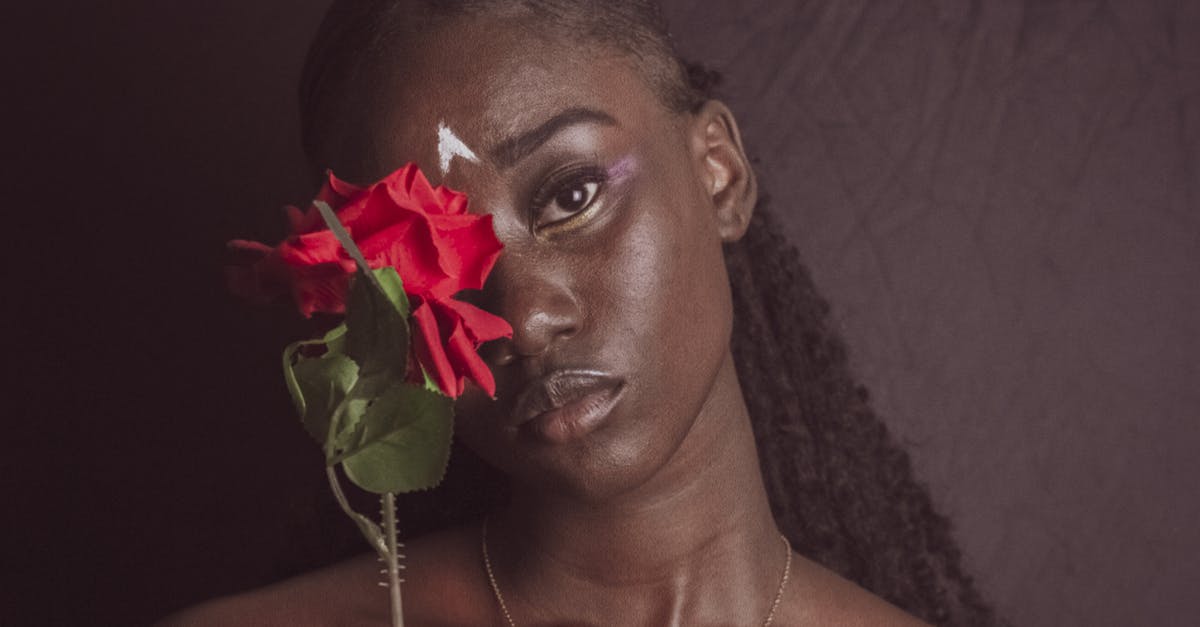 Beef meatballs look red inside but quickly disappear - Happy black woman with flower