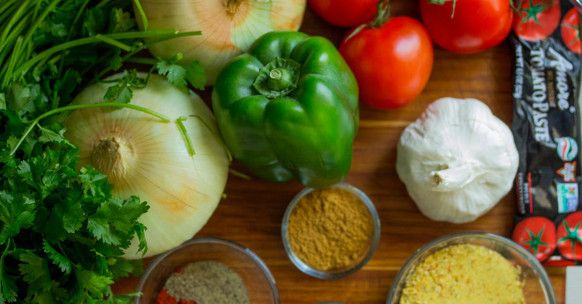 Bell Pepper cooking in the microwave - Assorted Vegetables and Spices on Wood Surface