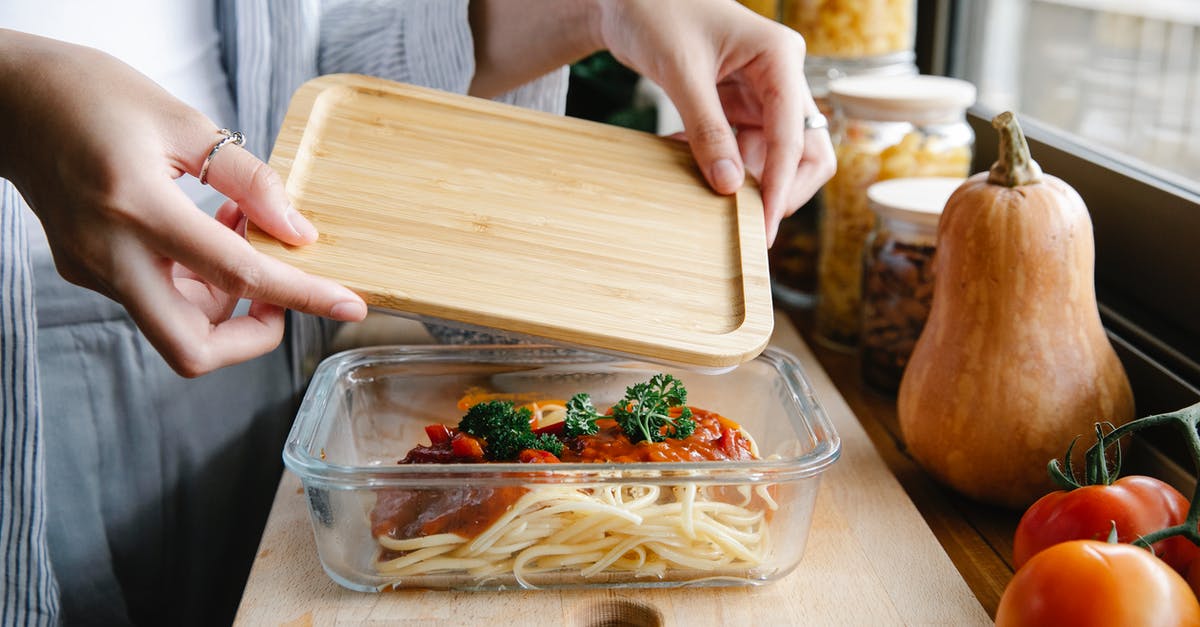 Benefit to covering pasta while cooking? - Unrecognizable woman preparing delicious homemade pasta with tomato sauce in kitchen