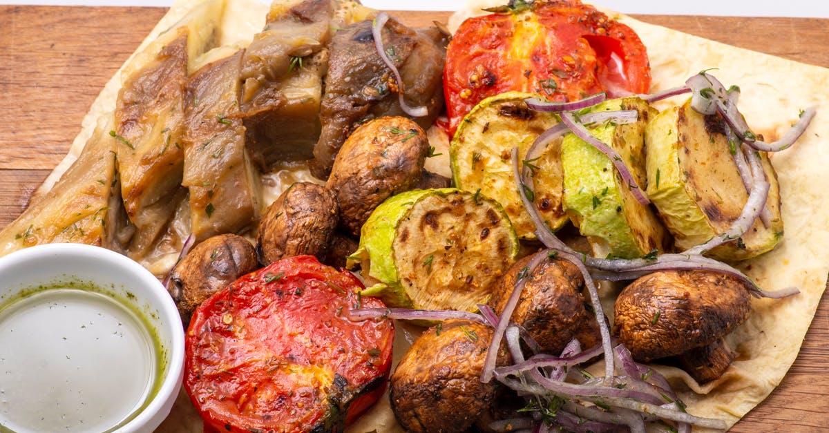 Best chopping board material for meat - A Delicious Food with Sliced Tomatoes and Onions in Close-Up Photography