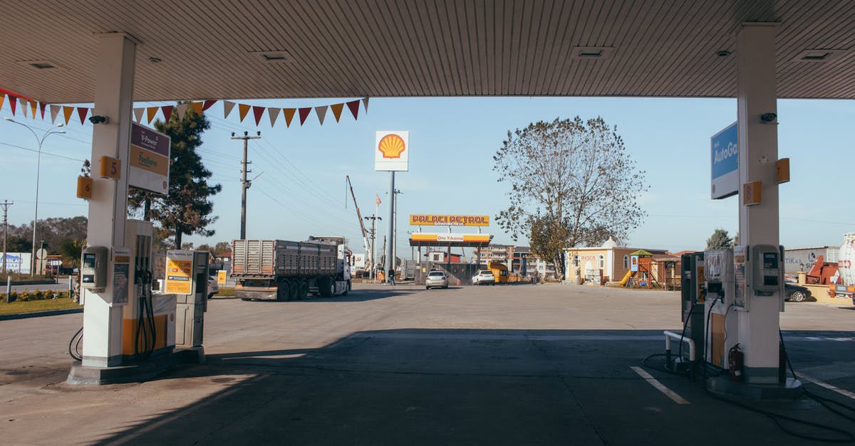 Best gas-stove cost effective alternative? - Empty gas station with oil petrol dispensers located on highway for serving long distance vehicles