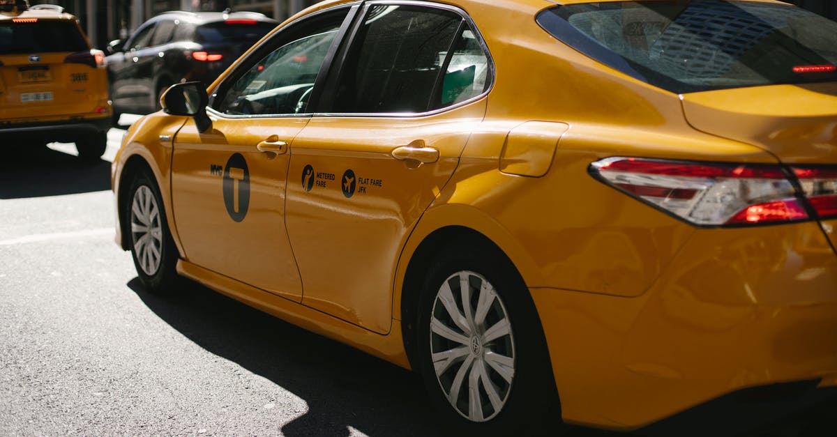 Best way to clean copper pots? - Shiny yellow taxi driving along busy street in downtown